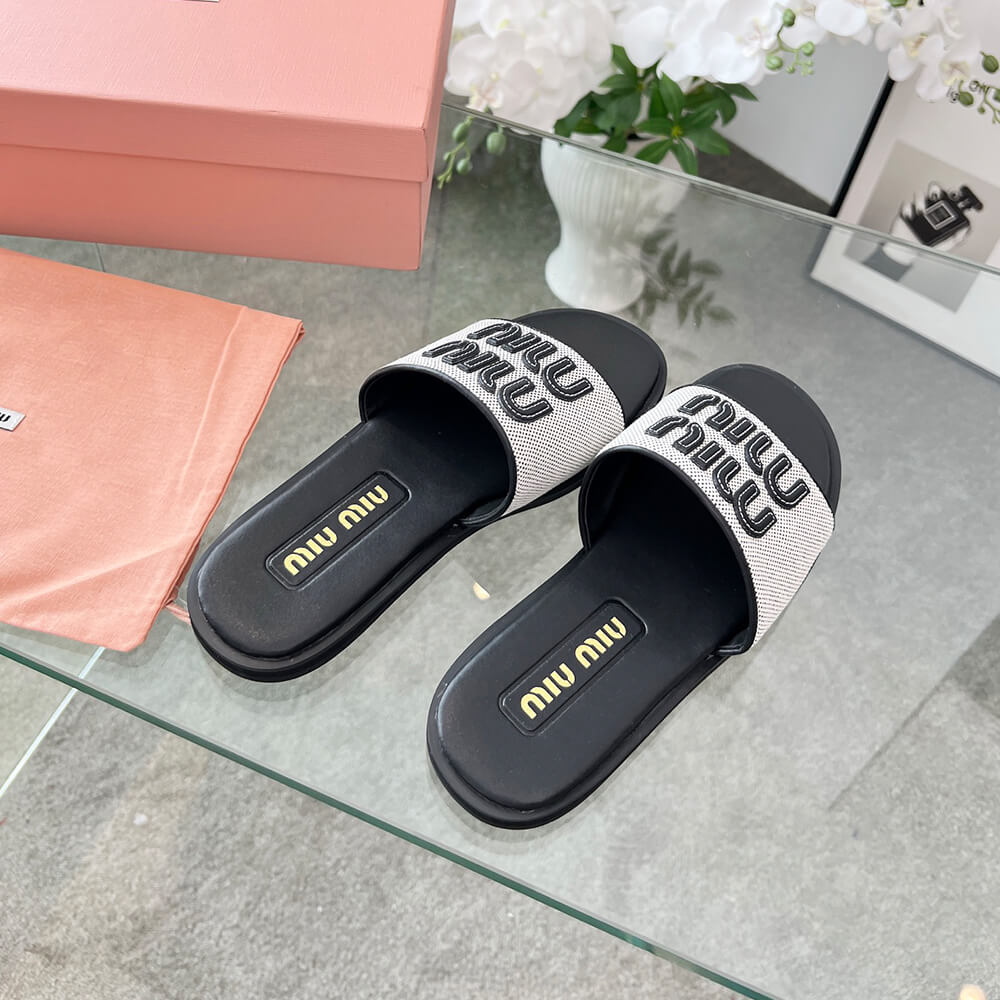 MiuMiu Canvas and leather slides