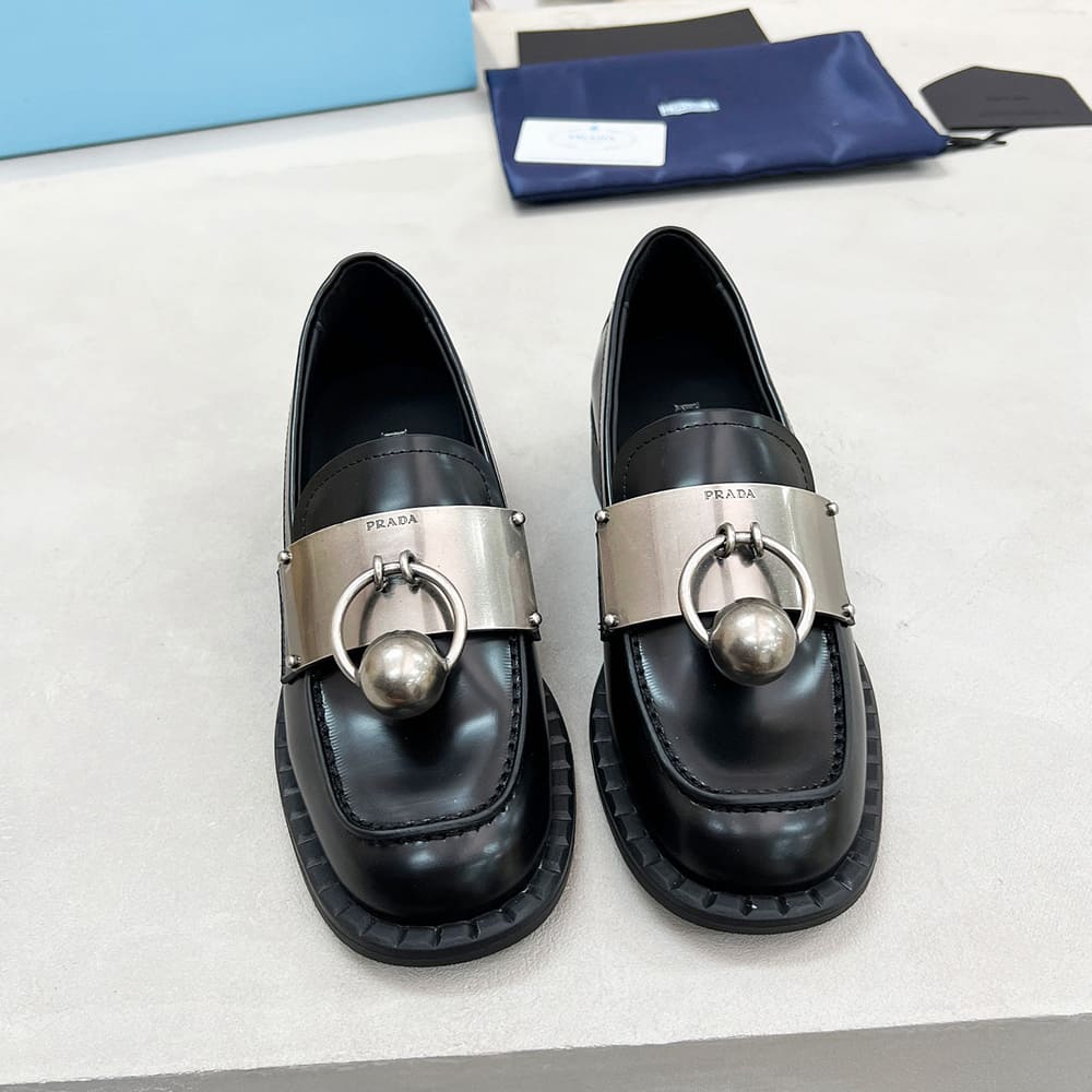 PRADA Brushed leather loafers with metal details